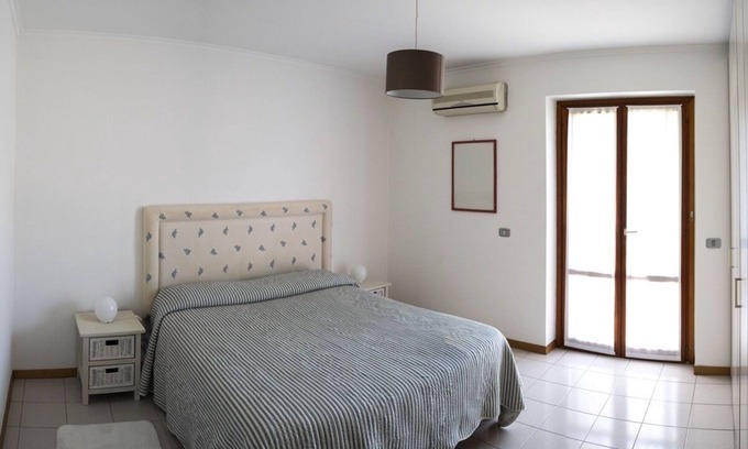 Capo Mulini Apartment | Elegant Two-Bedroom Apartment with Pool and Ocean Views