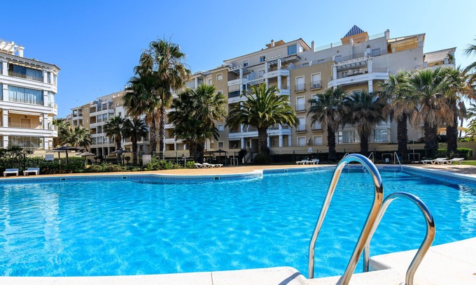 Punta del Moral Apartment | Discover Las Dunas with Ocean View & Poolside Bliss