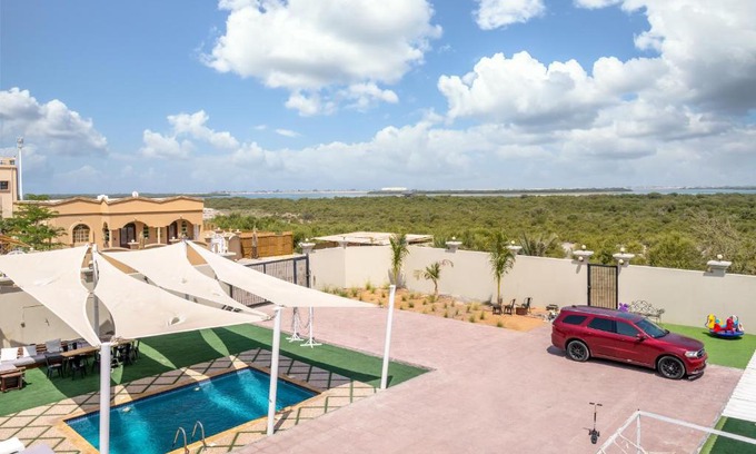 Ras Al Khaimah House | Explore Lazeemah Chalet: Oceanfront Retreat with Hot Tub