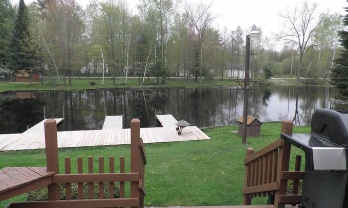 Cadillac House | Top-Rated Lazy Acorn "The Yellow Perch" on Lake Mitchell