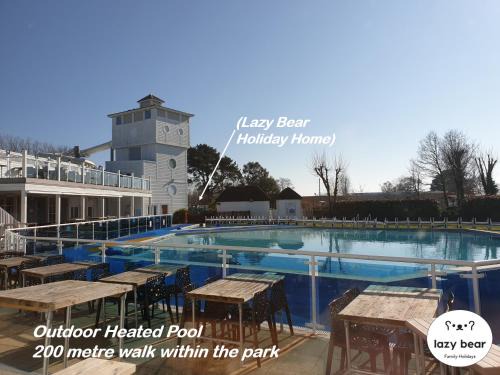 Hamworthy House | Relax at Lazy Bear with Oceanfront Pool & Spa Amenities