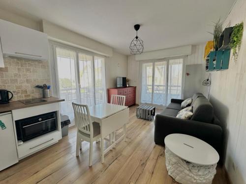 Courseulles-sur-Mer Apartment | Discover Le petit Courseulles: Portside Comfort Awaits