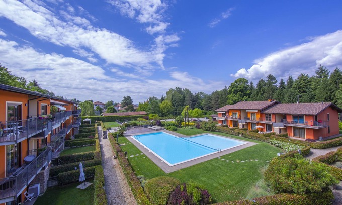 Sasso Moro Apartment | Discover Lenni Apart: Poolside Bliss in Leggiuno, Italy