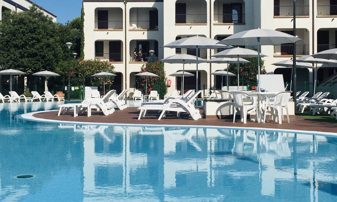 Lido di Spina Apartment | Relax at Belvilla by OYO in Lido di Spina with Pool Access