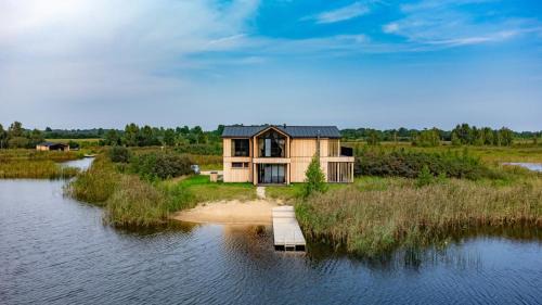 Jaunpils House | Discover Lielpīles: Oceanfront Retreat with Hot Tub & Pets Welcome