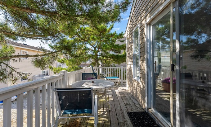 Townsend's Inlet Cottage | Bright Carriage House with Inviting Wrap-Around Deck