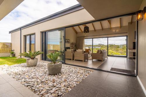 Kleinbaai Villa | Beachfront Lighthouse Villa Romansbaai with Hot Tub & More