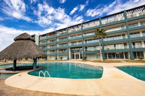Las Conchas Apartment | Linda Vista 401: Perfect Poolside Retreat for Families