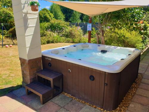 St Leonards House | Relax at Lions Lodge: Prime Location with Hot Tub Access