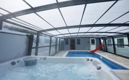 Lisvane Apartment | Elegant Retreat with Pool, Hot Tub & Sauna Awaits You
