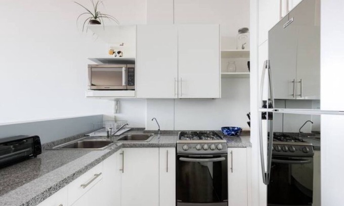 Escandon Condo | Charming Loft with Breathtaking City Views and Roof Garden