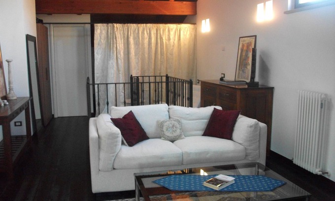 Busseto Apartment | Modern Loft with Bell Tower Views & Spa Access