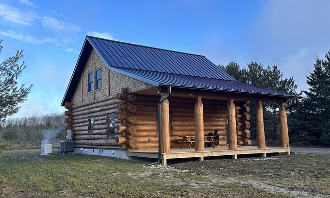 Levering Cabin | Cozy Log Cabin Minutes from Lake Michigan with Pool Access