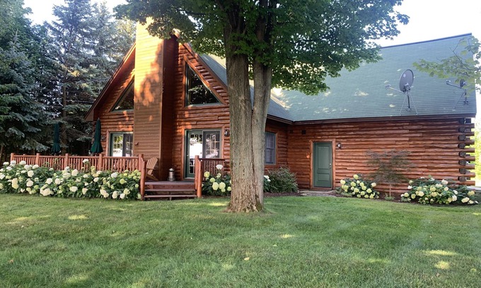 Kewadin House | Inviting Log Home with Pool Overlooking Torch Lake