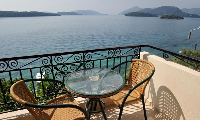 Perigiali Apartment | Beachfront Bliss at Logan's Beach Hotel - Rated 8.8/10