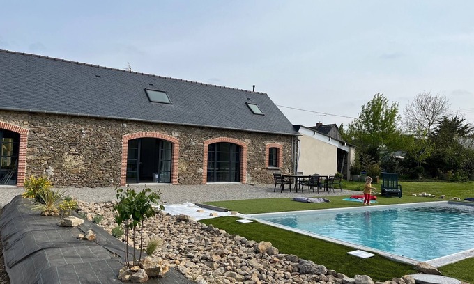 Prinquiau House | Charming Stone Retreat with Heated Pool for Family Fun