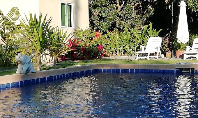 Khua Mung Hotel | Inviting Longan Tree: Poolside Comfort and Family-Friendly Stay