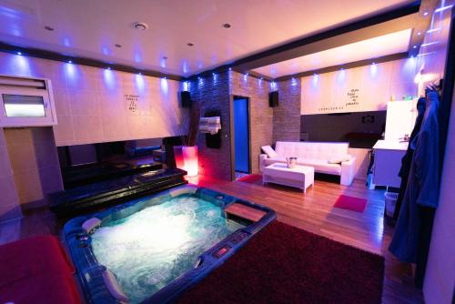 Republique - Tolstoi Apartment | Relaxation Awaits at Lovelove23spas with Hot Tub Access
