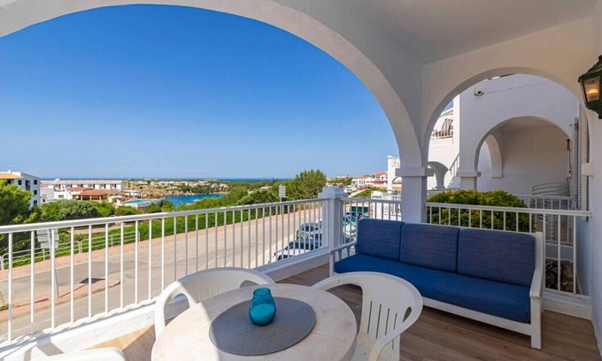 Arenal d'en Castell Apartment | Cozy Oceanfront Condo Steps from the Beach Awaits You
