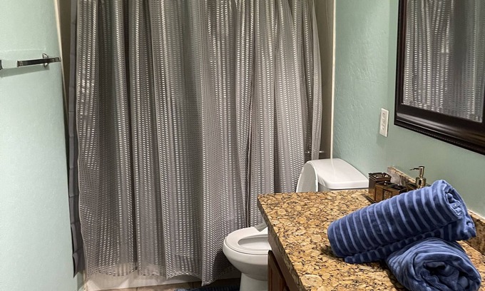 Laveen Village Bed & Breakfast | Stylish Bedroom with Smart TV and Pool Access