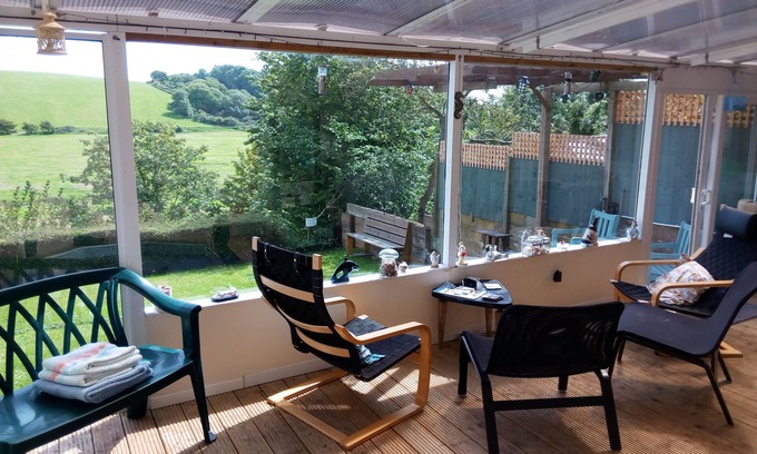 Brading Apartment | Bright Garden Apartment with Spa & Ocean View in Brading