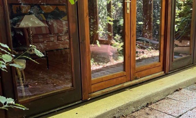 San Martino in Rio Cottage | Serene Wooden Retreat Nestled in Nature's Embrace