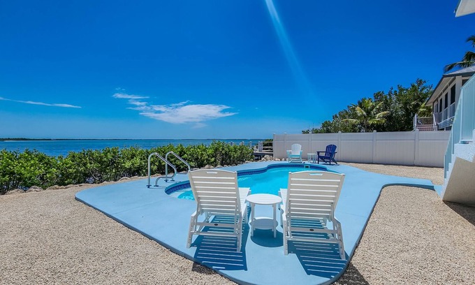 Breezeswept Beach Estates House | Low Key Sunrise: Waterfront pool home