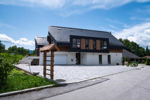 Zasip Apartment | Serene Stay at LUCKA BLED: Bikes, Garden & Family Fun