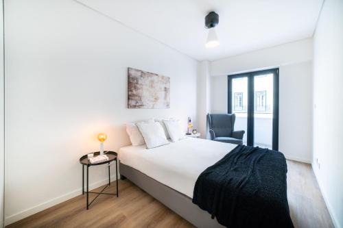 Santo Amaro Apartment | Inviting Lusíadas 53 2ºD - Cozy Two-Bedroom Retreat