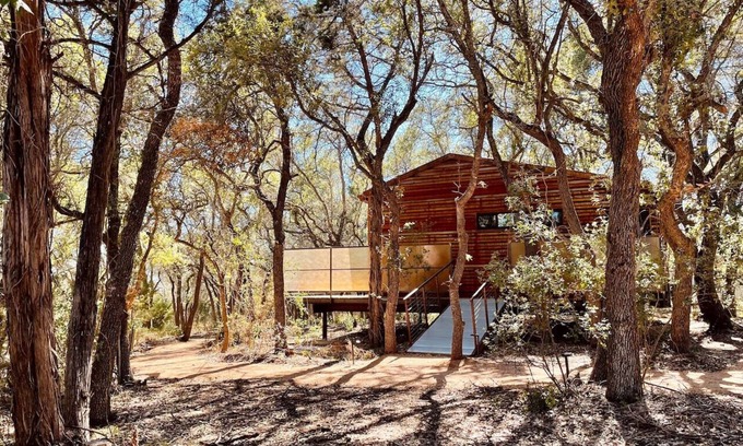 Dripping Springs Cabin | Modern Treehouse Escape with Pool and Firepit Amenities