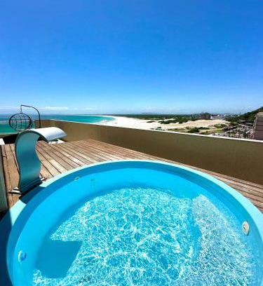 Praia Grande Apartment | Elegant Coastal Retreat with Pool and Oceanfront Views