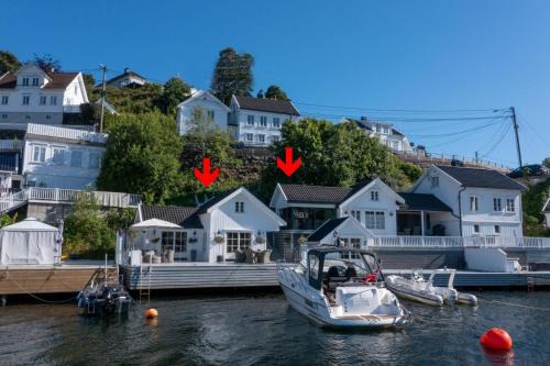 Arendal House | Elegant Boathouse with Private Dock and Oceanfront Views