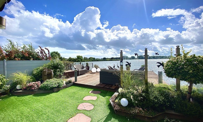 Onderdijk House | Tranquil Lakefront Home with Ocean Views and Family Amenities