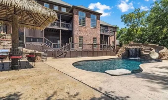 Bentonville House | Inviting Bentonville Custom European Home with Oasis Pool