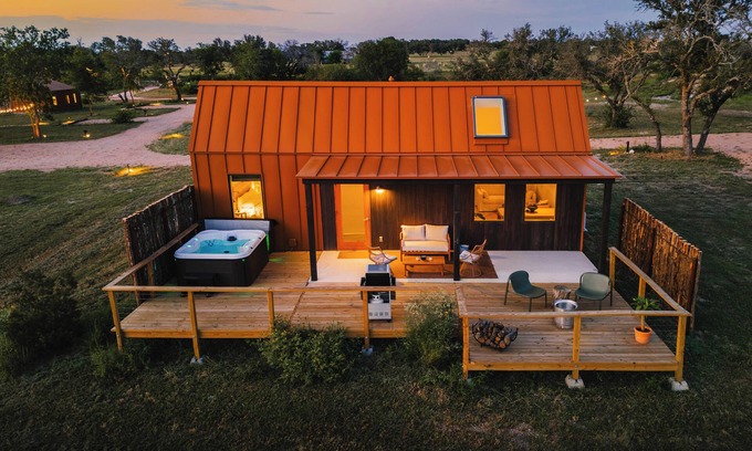 Stonewall Cabin | Luxury 1 BR cabin in the center of the Texas Wine Country with private porch, hot tub, gas grill and fire pit.