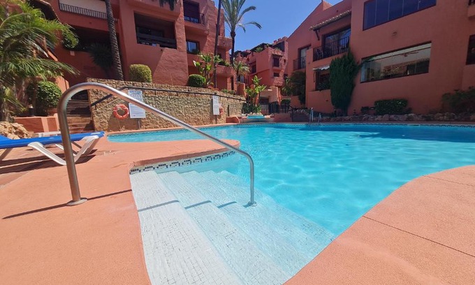 Elviria Apartment | Stylish Penthouse with Pool, Steps from the Beach