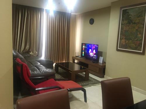 Karet Apartment | Elegant 2 BR Suite at The Grove with Pool & Dining Options