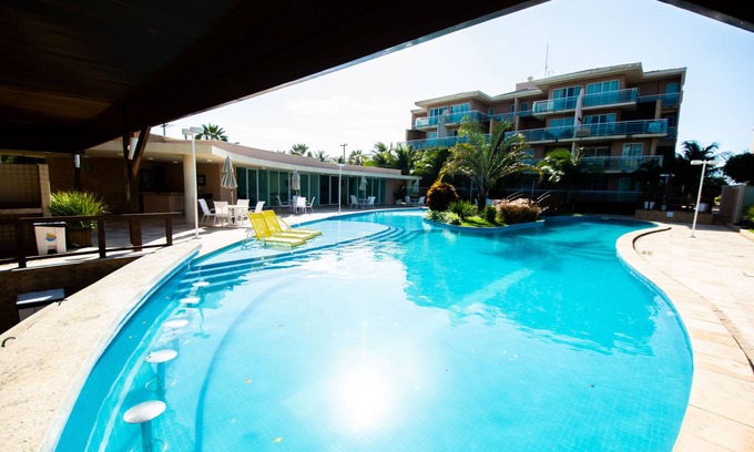 Porto das Dunas Apartment | Beachside Retreat with Pool and Ocean Views for Your Stay