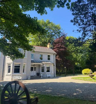 Kells House | Riverside Retreat in County Antrim with Hot Tub Experience