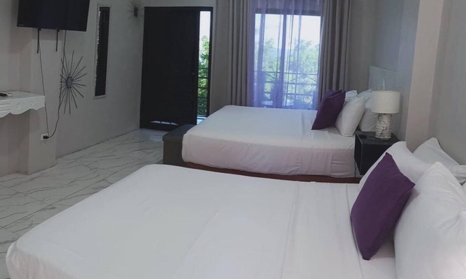 Port Antonio Hotel | Luxury havens with two kings or a king and queen bed, overlooking Port Antonio