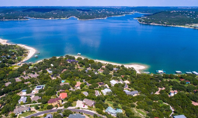 Comanche Trail House | Elegant Waterfront Retreat with Hot Tub & Private Dock