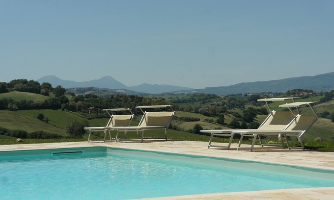 Montemaggiore al Metauro Apartment | Idyllic Apartment with Pool and Ocean Views Near the Sea