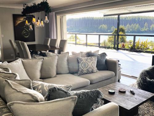 Mangakino House | Idyllic Lake House Retreat with Oceanfront Views & Hot Tub