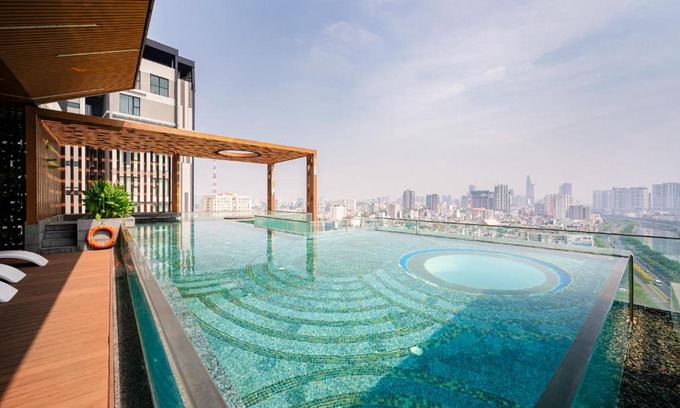 District 1 Apartment | Indulge at D1mension: 4-Star Retreat with Hot Tub & More