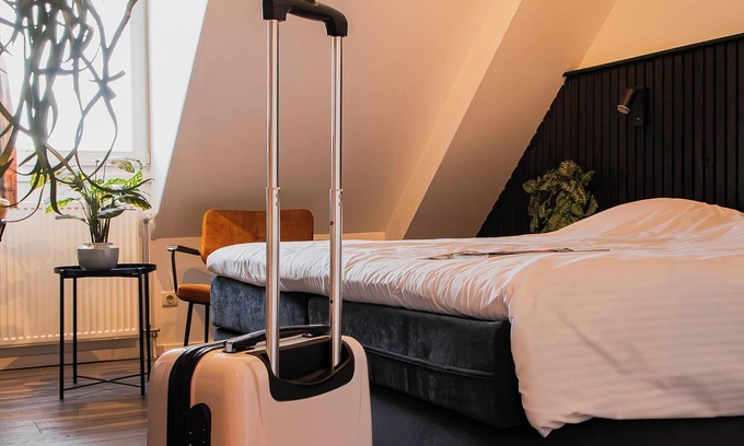 Municipality of West Maas en Waal Hotel | Luxury room with a balcony overlooking De Gouden Ham, offering modern amenities and a serene, picturesque setting.