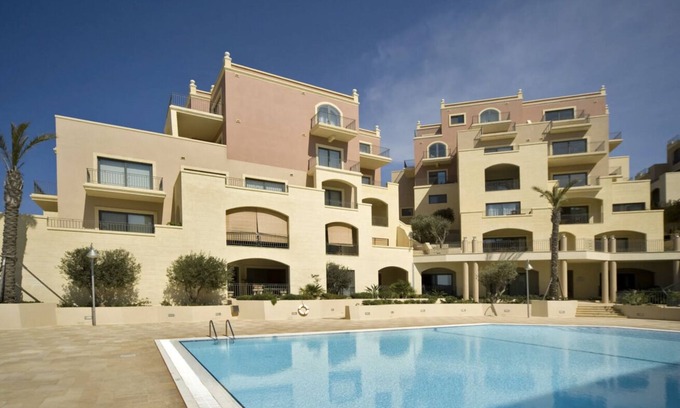 Għadira Apartment | Elegant Seaview Retreat with Pool & Family-Friendly Amenities