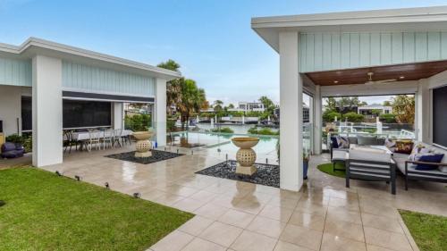 Moreton Bay Region House | Elegant Retreat on the Canal with Pool & Family Amenities