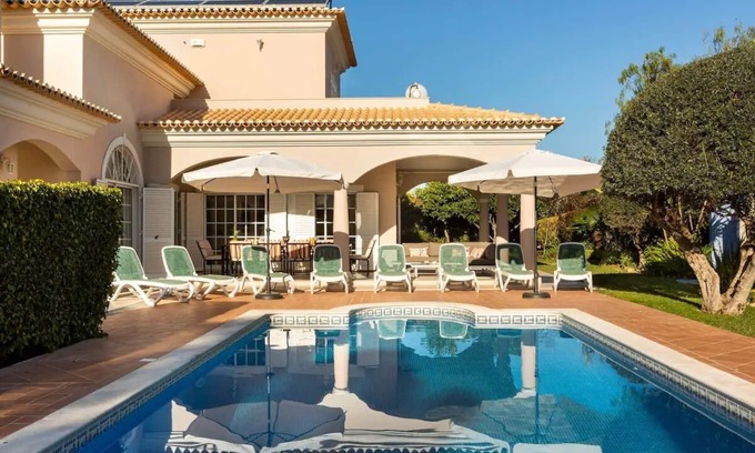 Quarteira Villa | Exceptional Villa Jose: Poolside Retreat with Ocean Views
