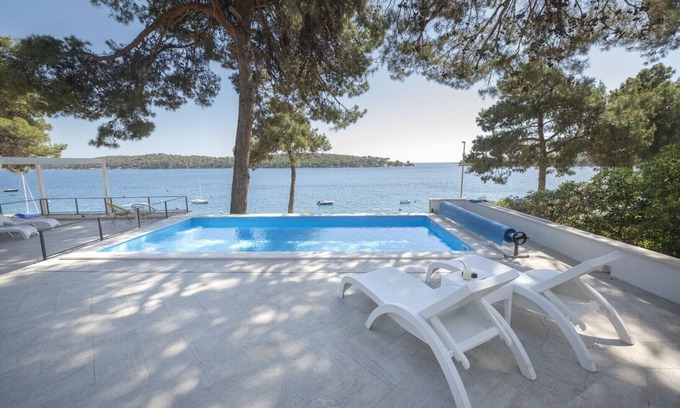 Cove Murtar Villa | Elegant Kallithea Villa: Heated Pool, Gym & Ocean View