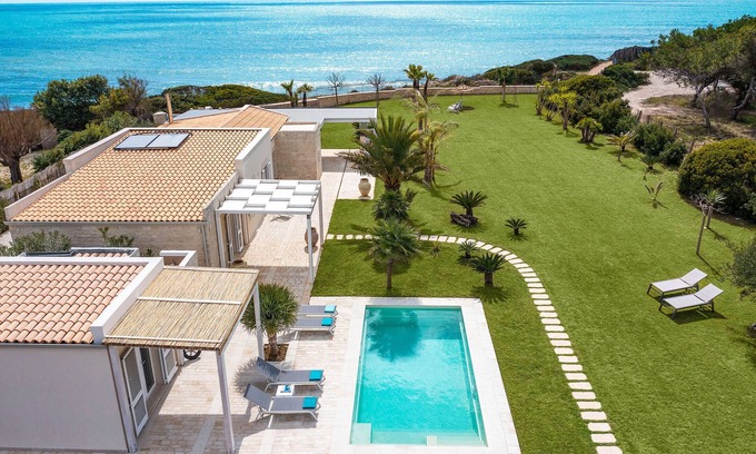 Santa Maria del Focallo Villa | Elegant Villa with Pool and Ocean Views in Porto Ulisse